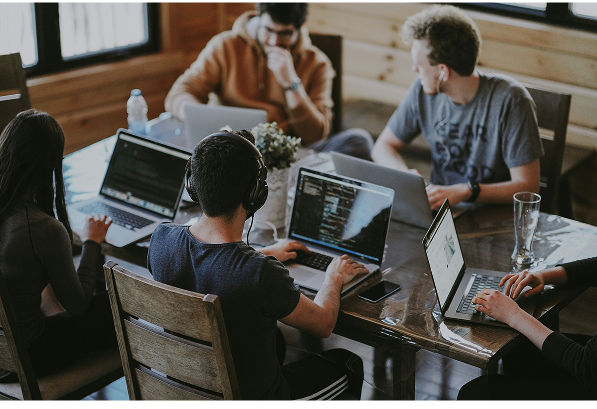 A team working together on laptops